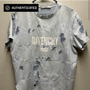 A Givenchy blue distressed shirt.